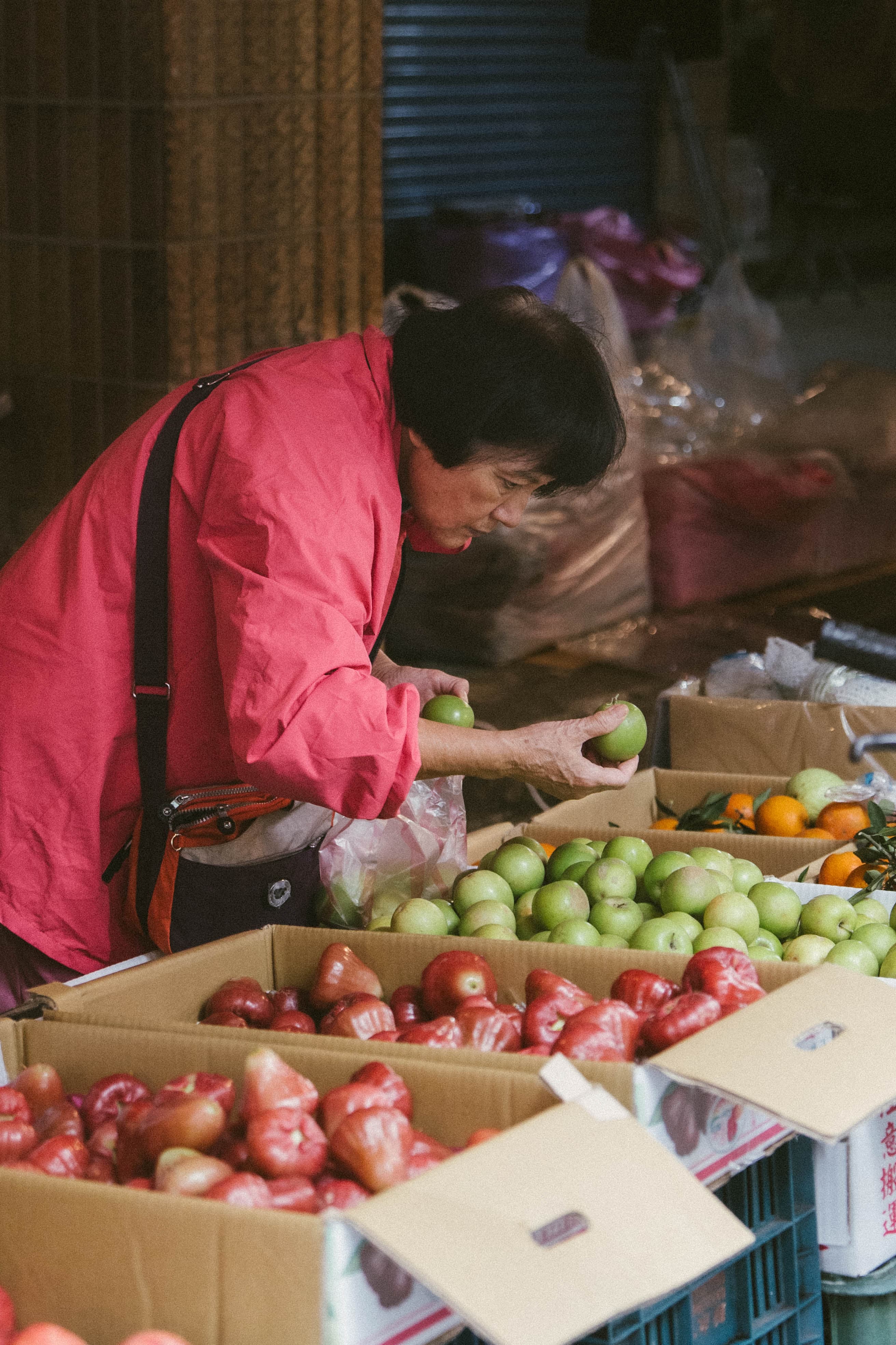 woman selecting fruit