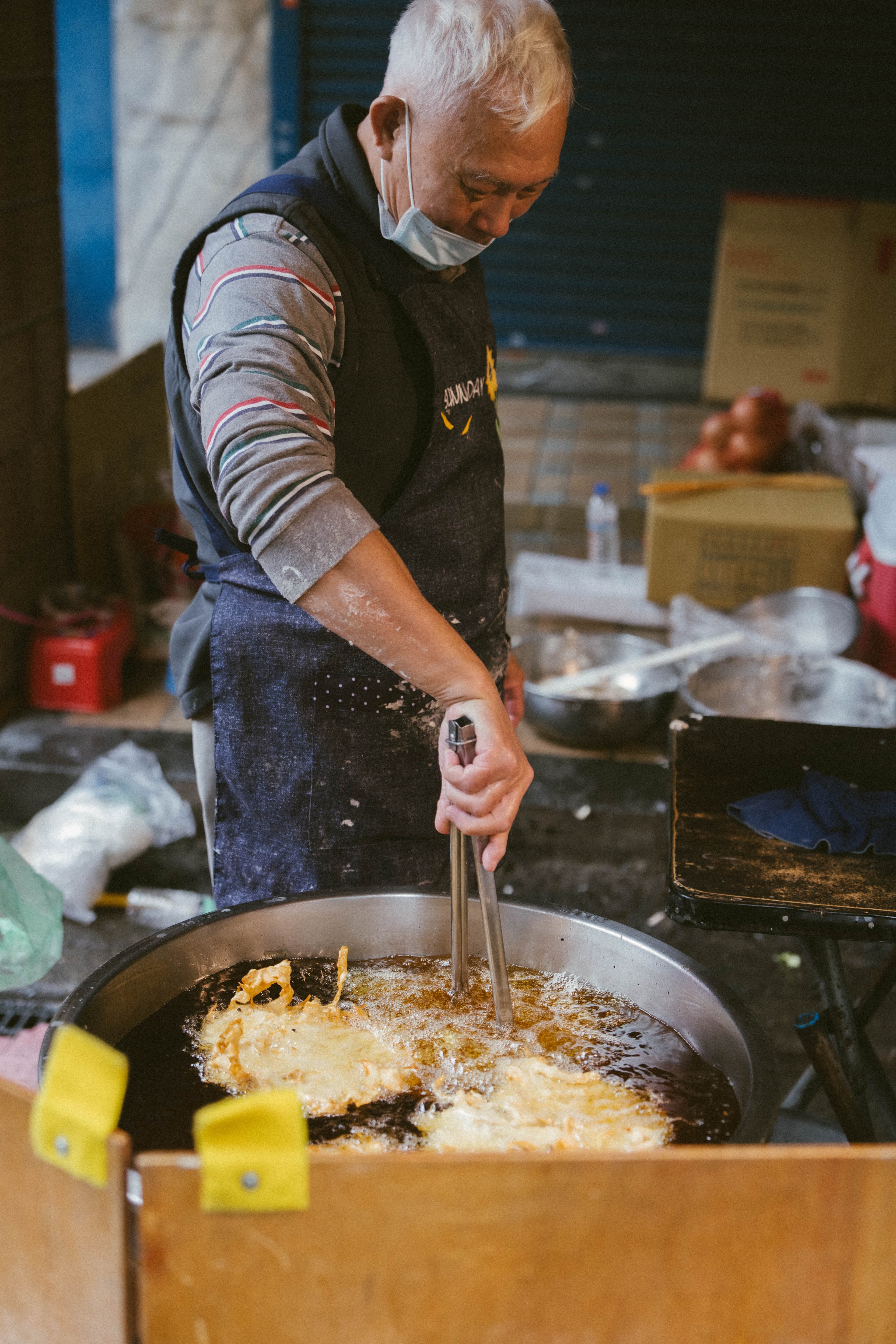 man frying breakfast